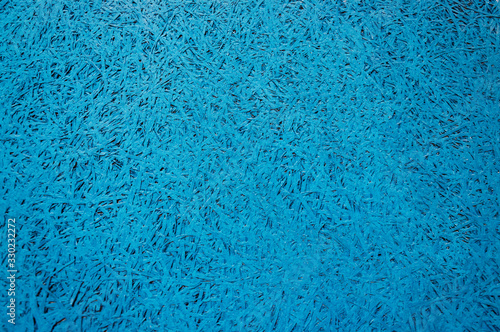 blue background, pressed wood chip texture