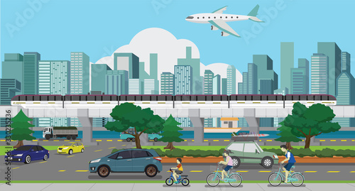 Townscape of High-speed rail through urban communities. The plane is above the building. Car traveling on the road. Family, parents, children, cycling on the road.