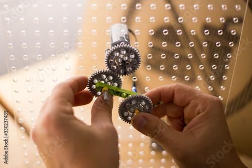 Hands on STEM education activity. Science lesson with hand made electric circuits.