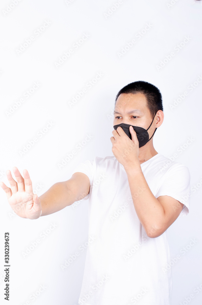 Asian man porttrait with stop hands gesture for break corona virus on white backgrounds concept Asian man porttrait with stop hands gesture for break corona virus on white backgrounds concept
