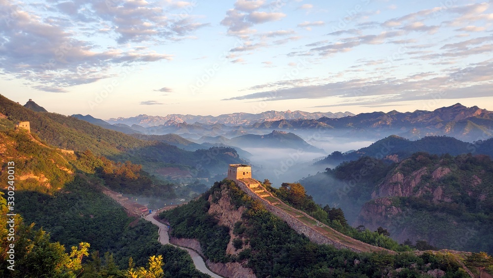 Great Wall, fog, and mountains at sunset in China