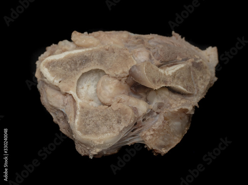 A piece of cooked meat with bone, isolated.