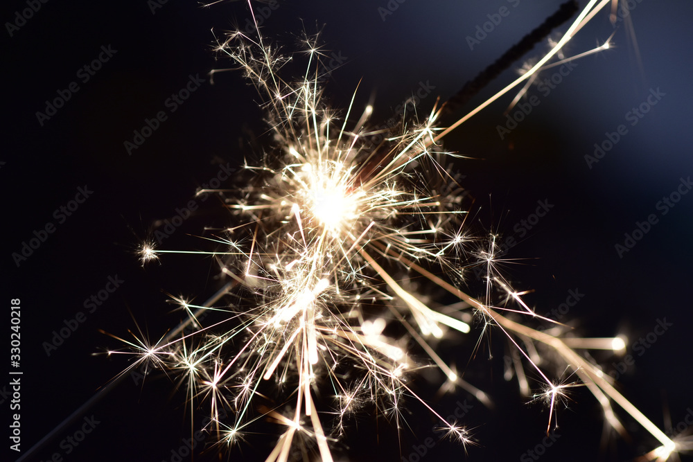 Bright sparks with black background; festive fireworks