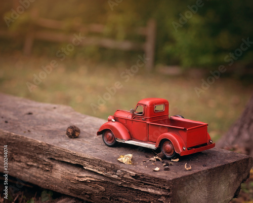 red toy truck on bench