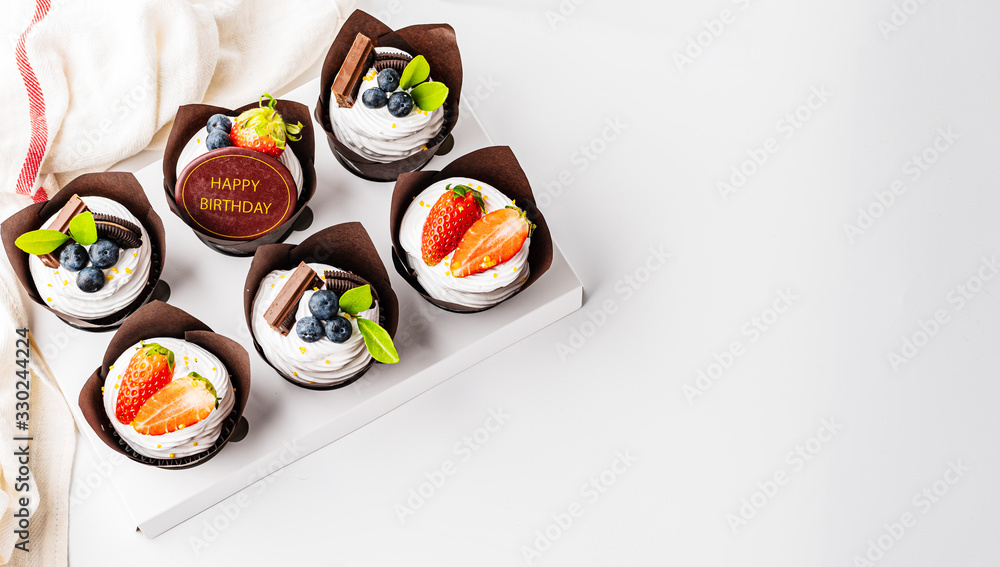 Cupcake on white background with copy space banner concept background Cupcake on white background with copy space banner concept background