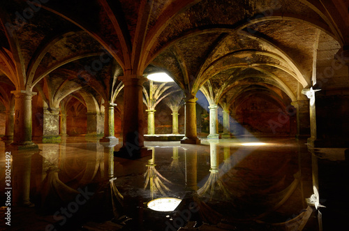 Bilde på lerret Shaft of light from skylight in underground Portuguese cistern in the old city o