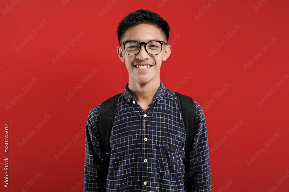 Young Asian Student Smiling on camera with eyeglasses