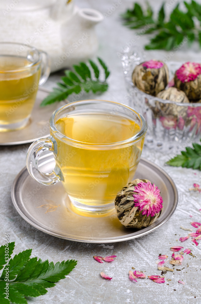 Green tea Bud with a red flower Green tea Bud with a red flower