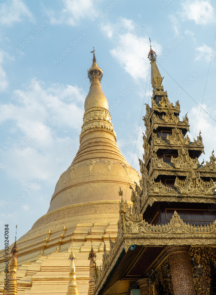 Fototapeta premium Shwedagon Pagoda golden intricate temples and stupa.
