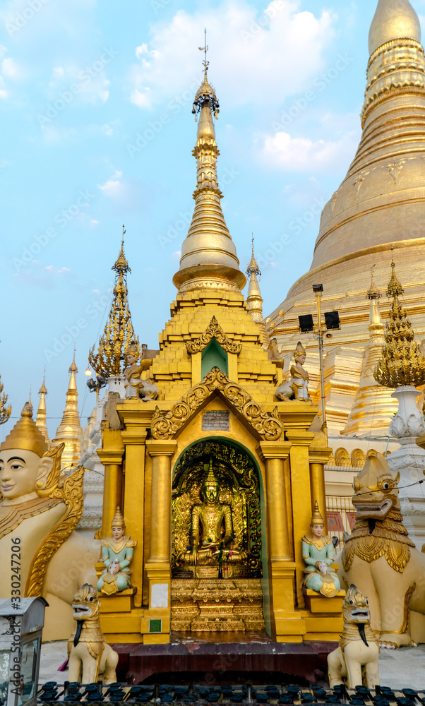 Naklejka premium Golden Buddha statue at Shwedagon Pagoda, Yangon, Myanmar.