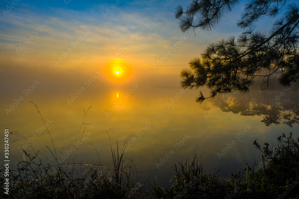 Sunrise at the reservoir on Phu Kradueng, Loei ,Thailand