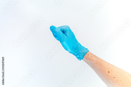 Fist hand in medical glove on white background.