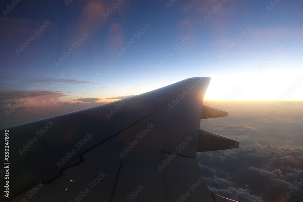 plane wing in sunset plane wing in sunset
