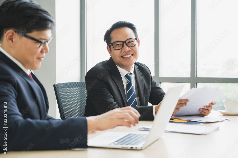 Asian business people team analyzing statistics financial. Team of businesspeople Meeting Conference Discussion Corporate Concept in office. Asian business people team analyzing statistics financial. Team of businesspeople Meeting Conference Discussion Corporate Concept in office.