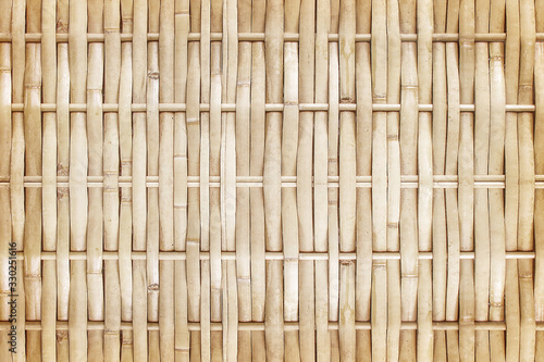 old grungy thai handcraft of bamboo weave pattern fence.