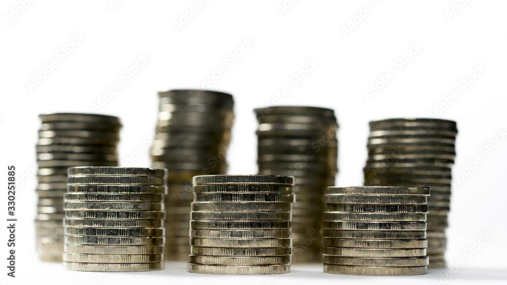 Coins on stack on white background - stop motion . Coins on stack on white background - stop motion .
