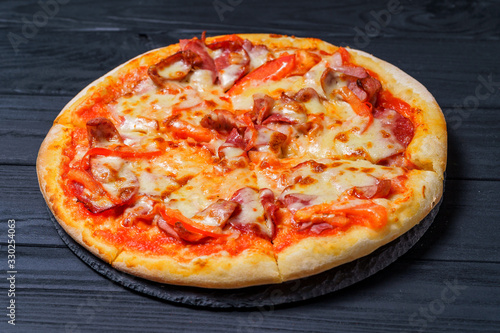 Delicious pizza on wooden table. Food delivery