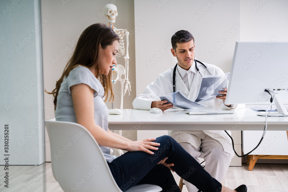 Doctor Having Discussion With Patient About X-ray Doctor Having Discussion With Patient About X-ray