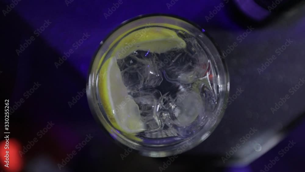 Close up of a professional bartender is preparing an alcoholic cocktail Close up of a professional bartender is preparing an alcoholic cocktail