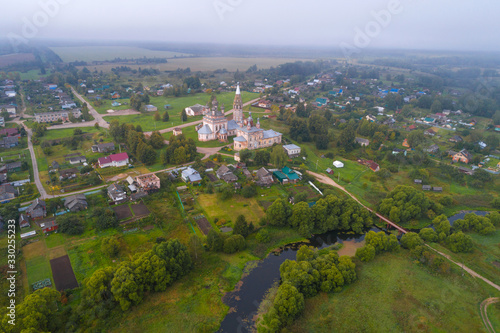 Aerial view of the village of Parskoye with old temple complex on a September morning. Ivanovo region, Russia
