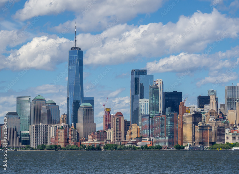 New York, NY, USA. Amazing skyline of Manhattan skyscrapers and buildings from Ellis Island. Landscape inclusive of the Freedom tower - One World Trade Center