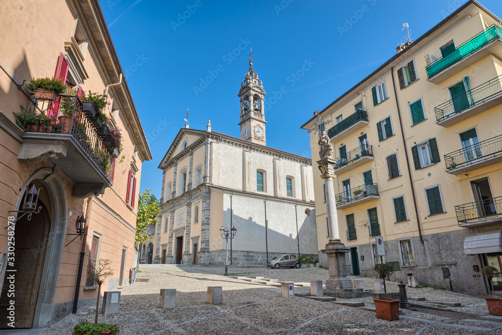 Historic center of the town of Oggiono with the church of S. Eufemia (17th century), street 1 Maggio . Oggiono is a small town on Lake Annone in northern Italy, province of Lecco