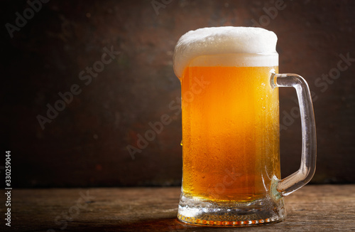 mug of beer on a wooden table