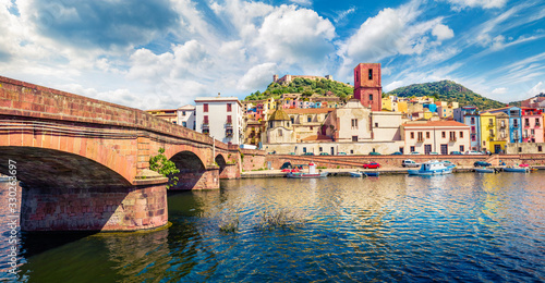 Magnificent summer cityscape of Bosa town with Ponte Vecchio bridge across the Temo river. Spectacular morning view of Sardinia island, Italy, Europe. Traveling concept background.