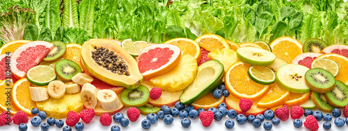 Naklejka Fresh fruit berries green salad collection. Tropical papaya, pineapple, apple, orange, kiwi,mixed citrus salads food. Healthy fruity diet concept. Fruit background, banner