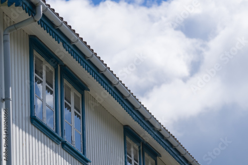 Wallpaper Mural Close up of white house with blue windows Torontodigital.ca