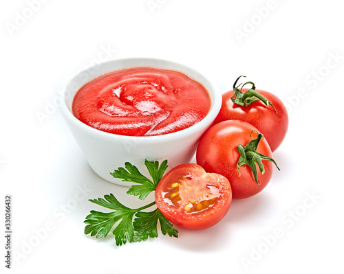 Fresh, organic tomato puree, isolated on white. Tomato cherry sauce in bowl, cooking concept. Healthy vitamin vegetables, vegan diet food condiment. Raw tasty cherry ketchup.