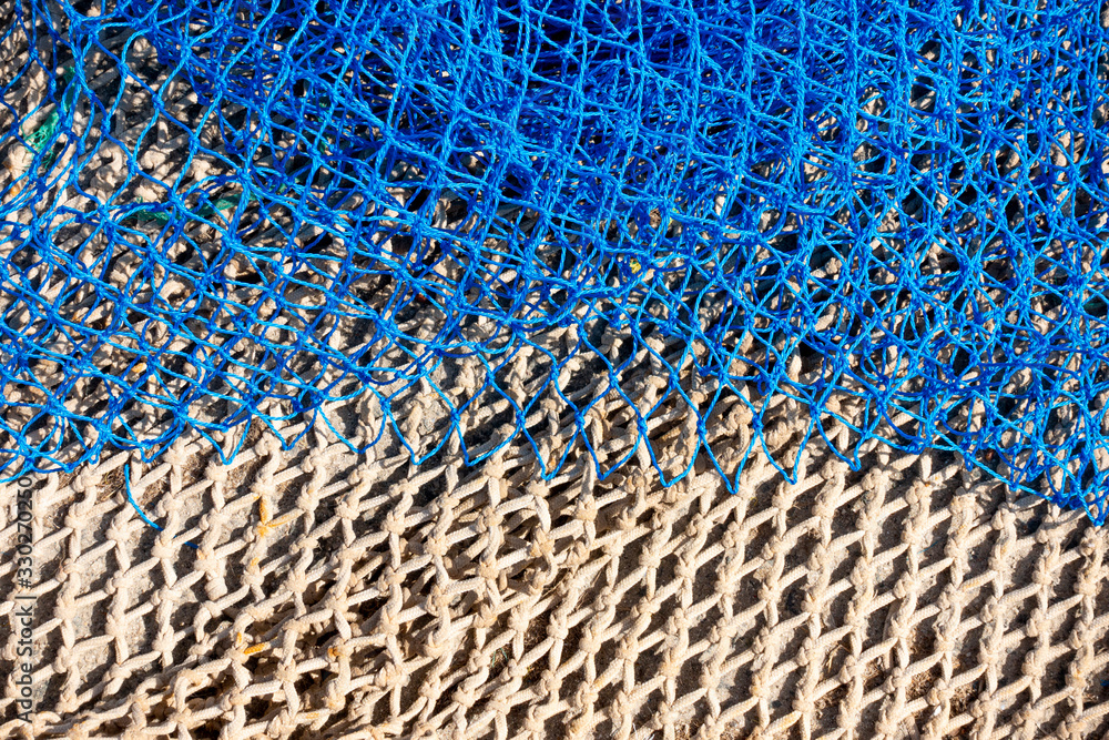 Naklejka premium Commercial beige and blue color fishing nets background