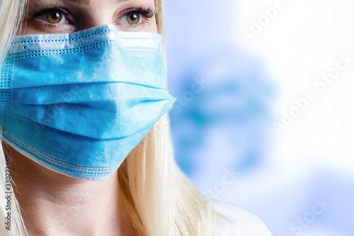 Cropped image of female physician wearing medical mask