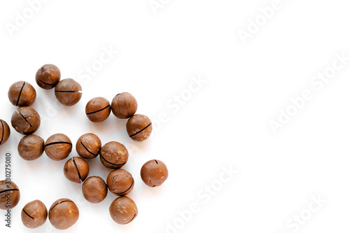 Macadamia nuts in the shell isolated on a white background close-up.