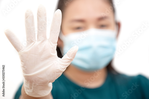 The image face of a young Asian woman wearing a mask to prevent germs  toxic fumes  and dust. Prevention of bacterial infection Corona virus or Covid 19 in a white background.