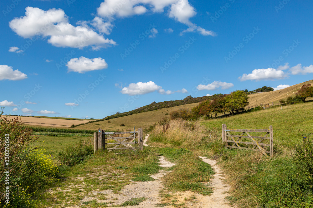 A pathway along the South Downs Way in Sussex, on a sunny late summers day