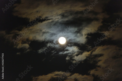 Photo of the moon in the clouds at night