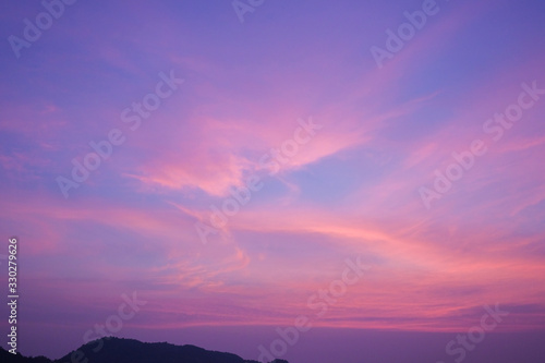 Fototapeta Naklejka Na Ścianę i Meble -  Stunning purple sunset on a tropical beach.