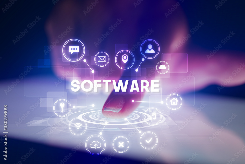 Finger touching tablet with web technology icons and SOFTWARE inscription, web technology concept Finger touching tablet with web technology icons and SOFTWARE inscription, web technology concept
