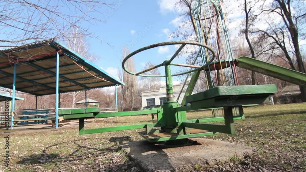 Old Merry-Go-Round Spinning In Eastern European Orphanage Playground Old Merry-Go-Round Spinning In Eastern European Orphanage Playground