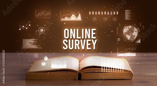 Tableau sur toile ONLINE SURVEY inscription coming out from an open book, creative business concep