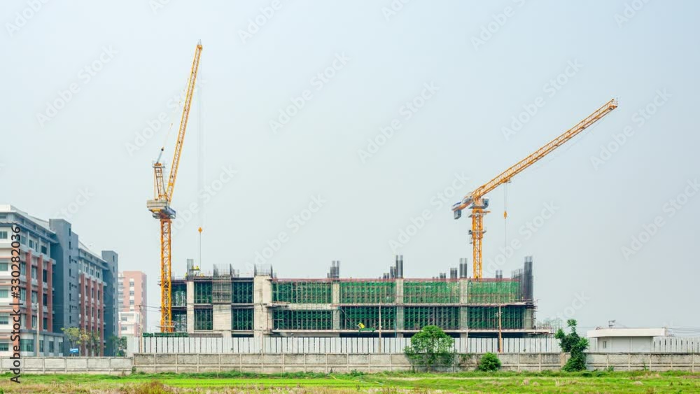 Crane and workers working on building construction