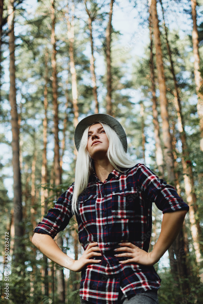 Portrait of young adult female walking in the forest, selective focus Portrait of young adult female walking in the forest, selective focus