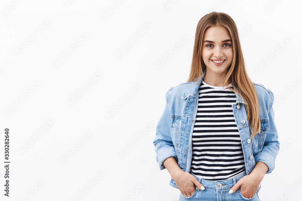 Obraz premium Ready young blond smiling woman professional, hold hands in pockets with happy face, confident in own abilities, lifestyle and people emotions concept, standing white background spring outfit