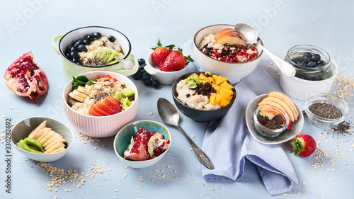 Bowls of oatmeal with berries and fruits  for healthy breakfast. Food with vitamins  minerals and antioxidants.