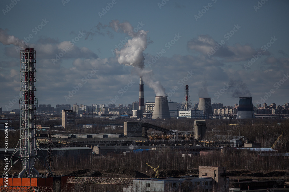 view from the roof of a high-rise building on an industrial area on the outskirts of a city