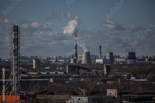 view from the roof of a high-rise building on an industrial area on the outskirts of a city