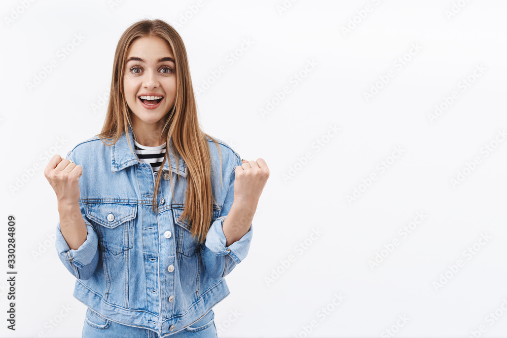 Surprised cheerful girl realise won, clench fists triumph, smiling happy and looking camera hopeful, watching sport competition and rooting for team, celebrate success and victory, white background Surprised cheerful girl realise won, clench fists triumph, smiling happy and looking camera hopeful, watching sport competition and rooting for team, celebrate success and victory, white background