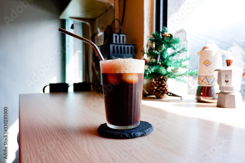 A glass of iced Americano, black coffee