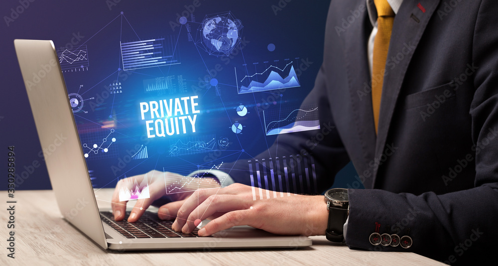 Businessman working on laptop with PRIVATE EQUITY inscription, new business concept Businessman working on laptop with PRIVATE EQUITY inscription, new business concept